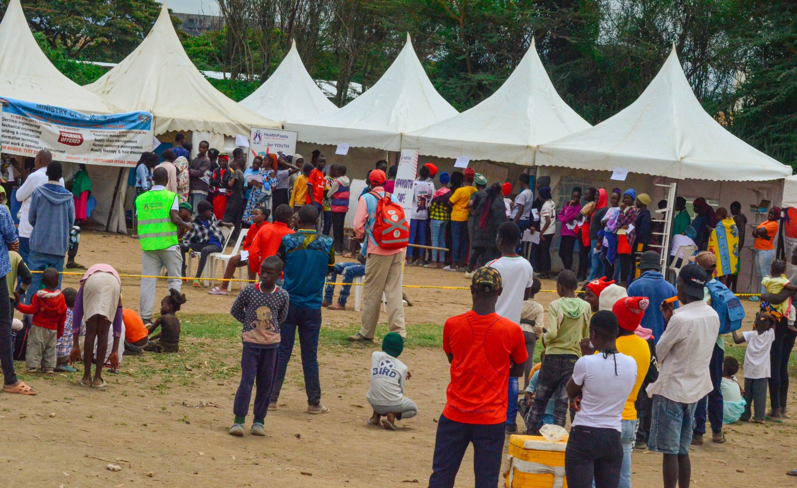 Community members visiting HealthPosts outreach tents